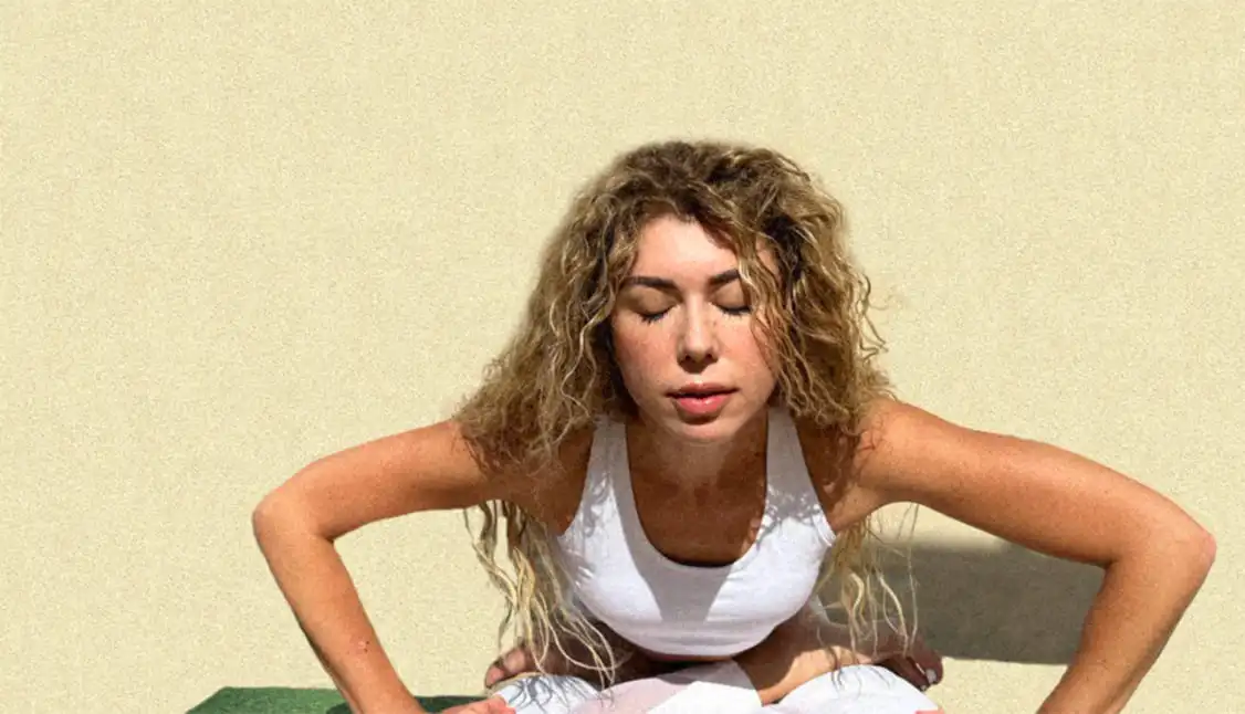 A group of people enjoying a yoga session in a serene park.