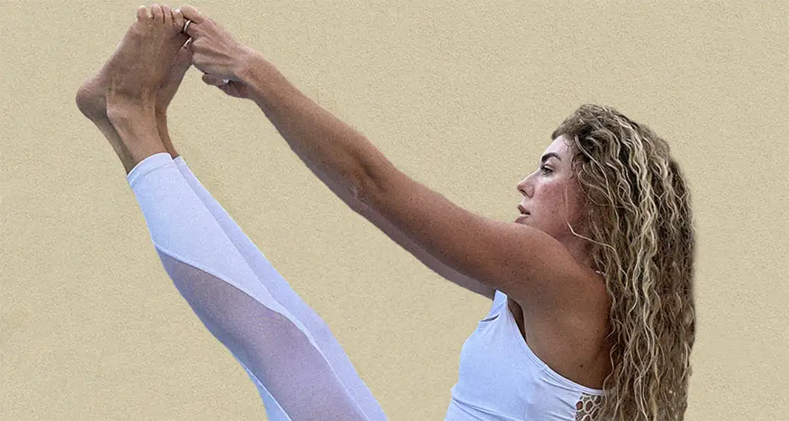 A close-up of Yana demonstrating a yoga posture.